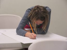 Girl Writing on Paper